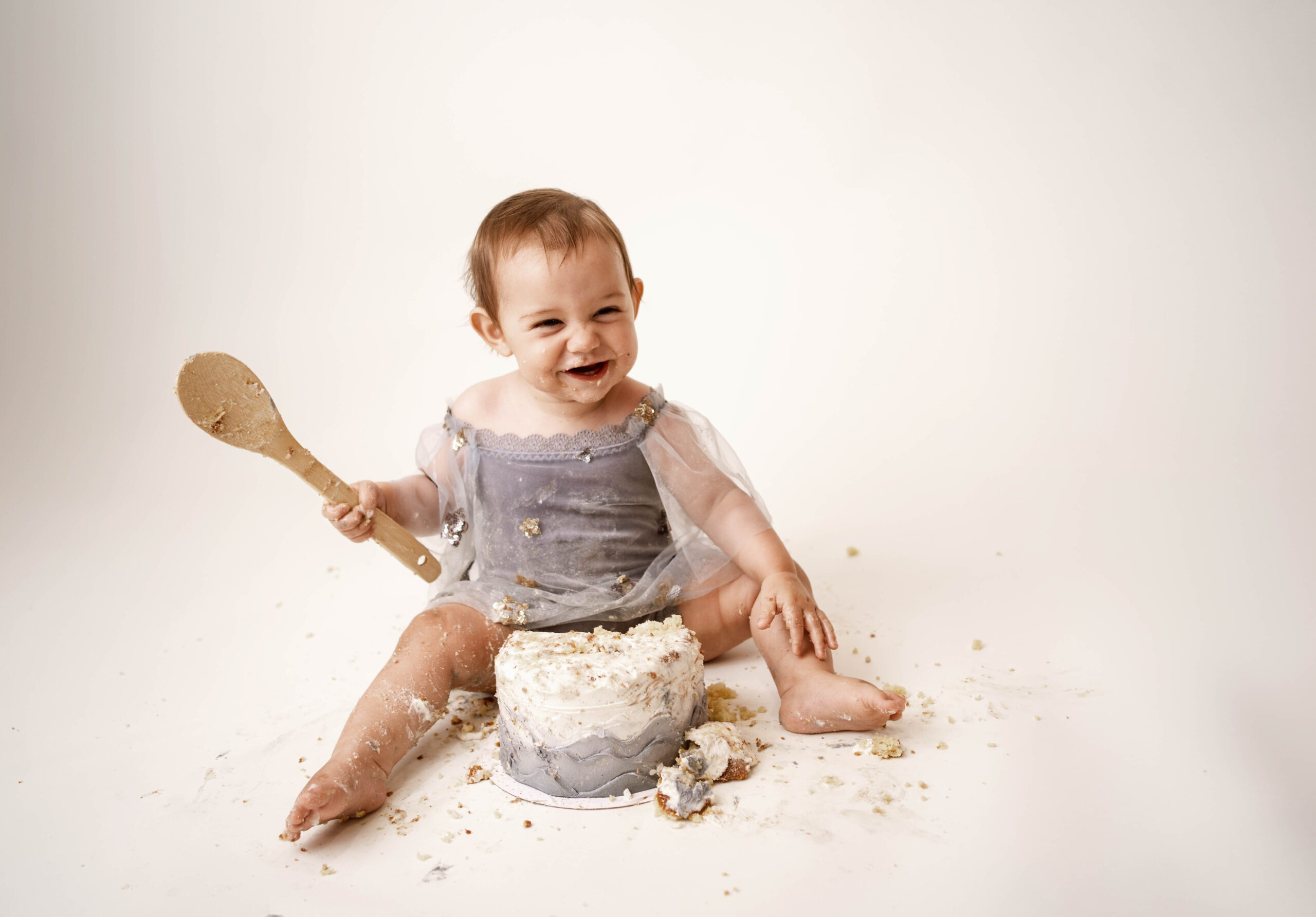 baby eating cake during cake smash session in rio,wi.