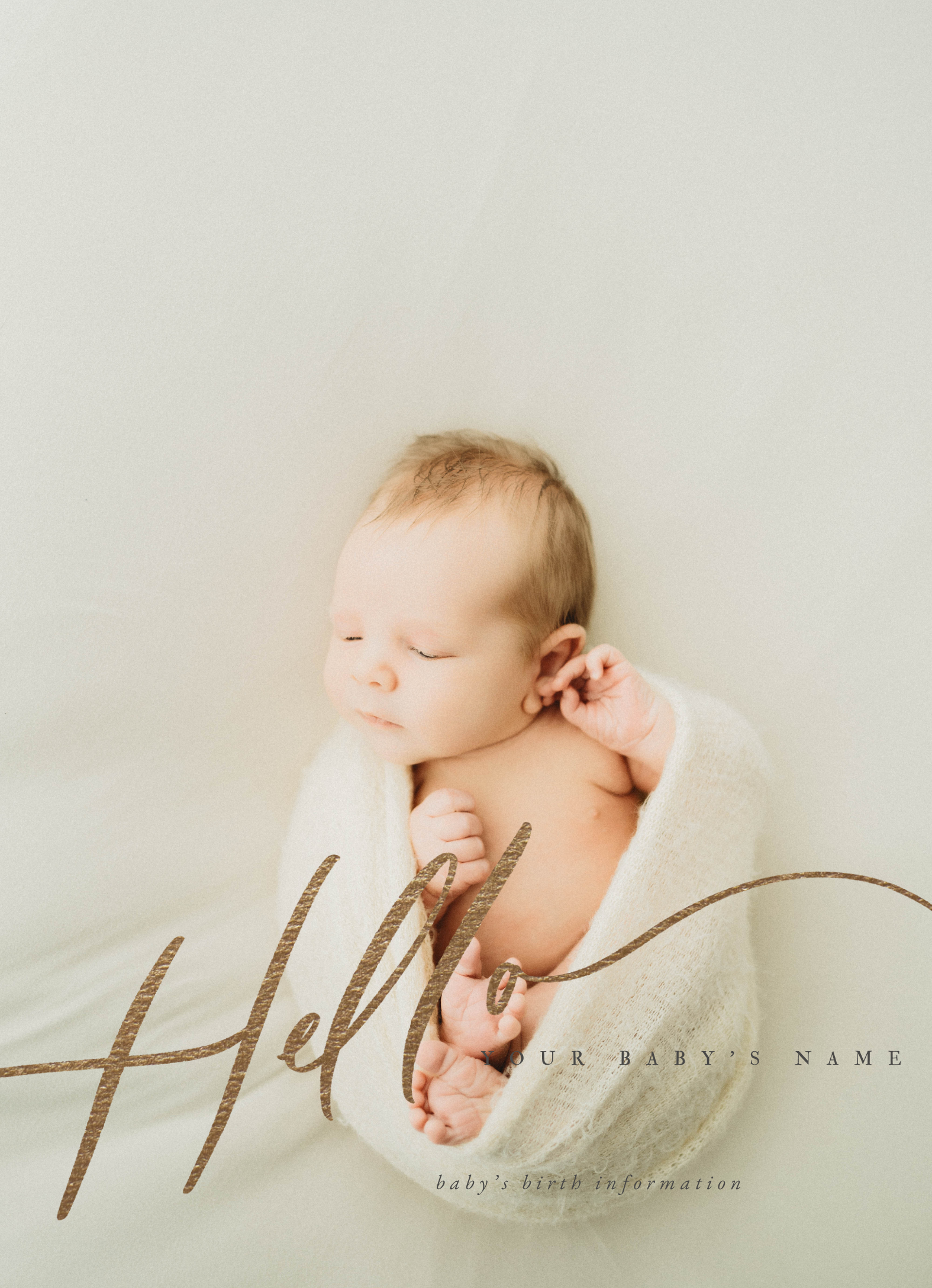 Newborn boy in white wrap laying on a white backdrop for a sun prairie Wisconsin newborn session