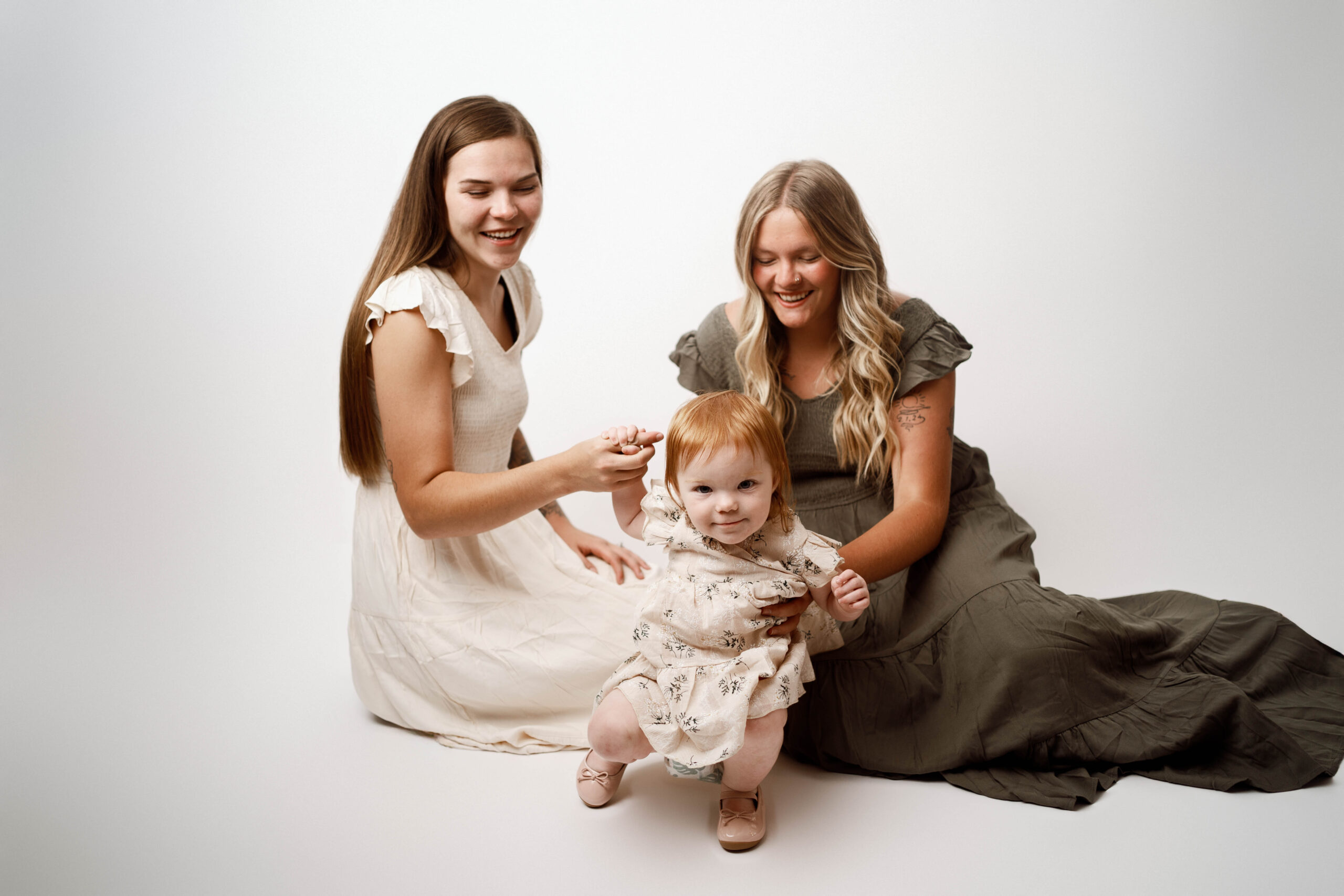 mom with two daughters in rio, wi studio for a simple white session.