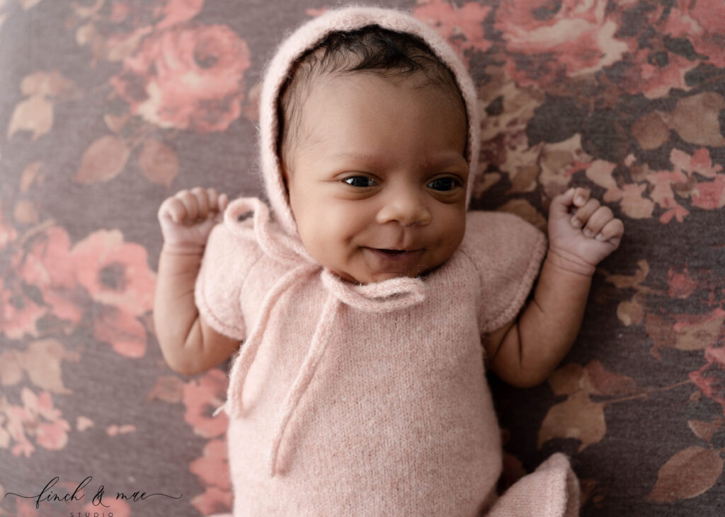 Newborn baby girl photographed during a timeless studio newborn session in Southern Wisconsin.