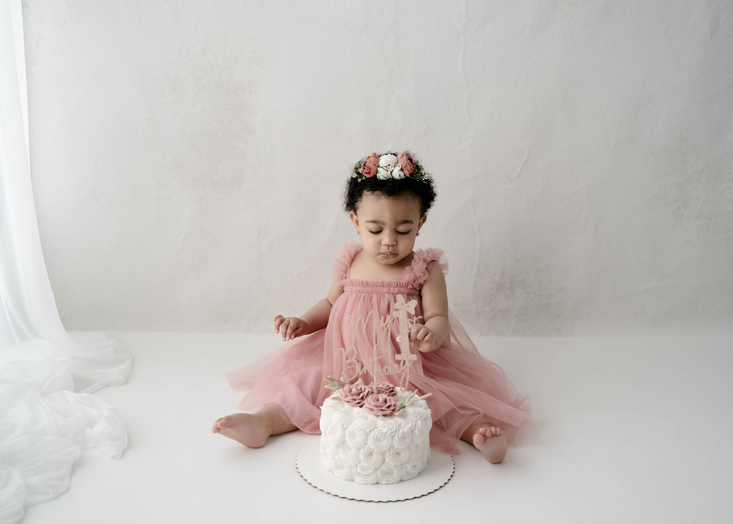 One year old girl eating cake for her cake smash in Rio, wi.