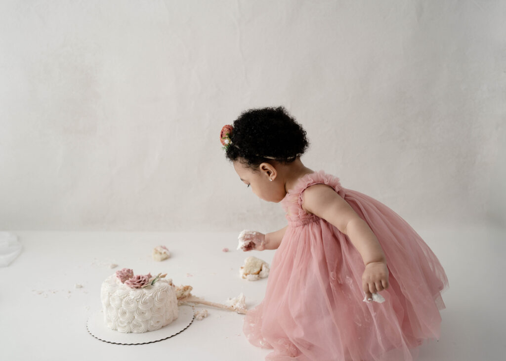     One year old girl during Smash Cake Saturdays session